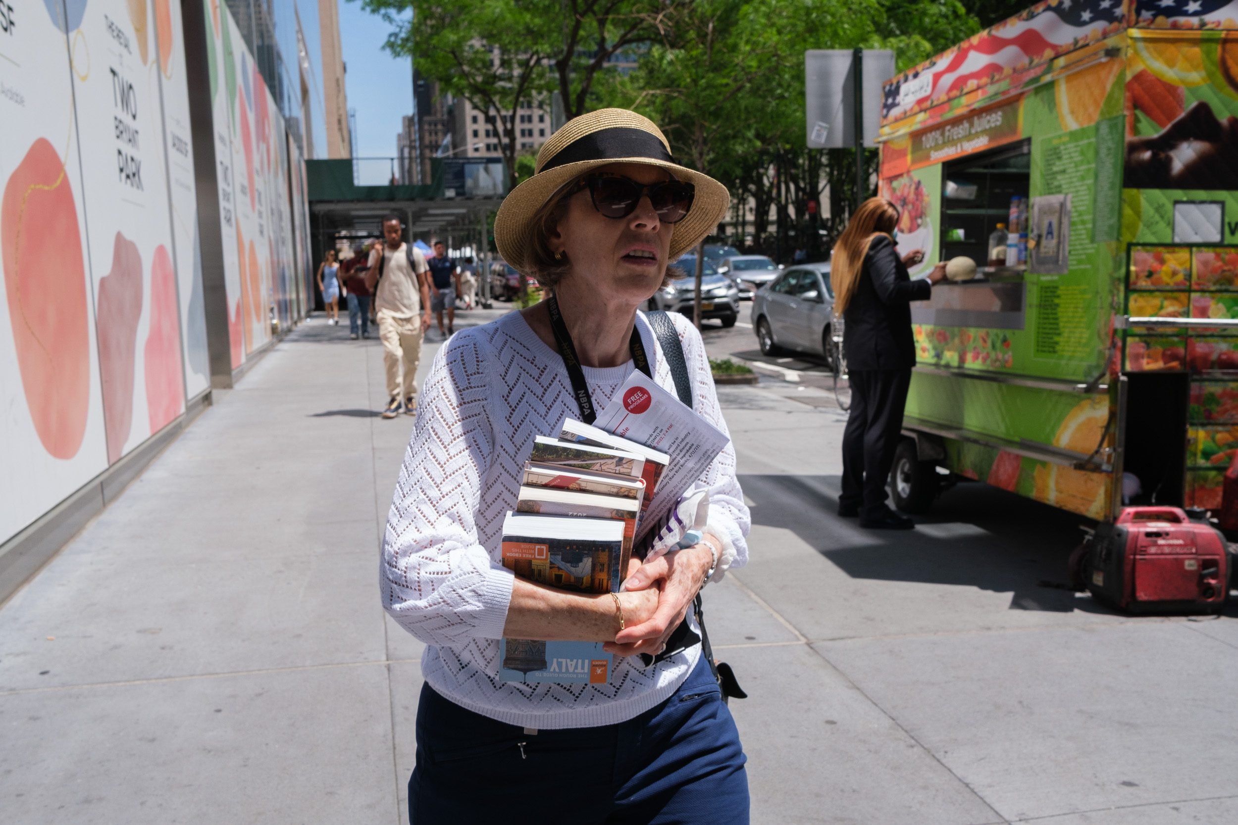 Person holding tour guide books in New York City