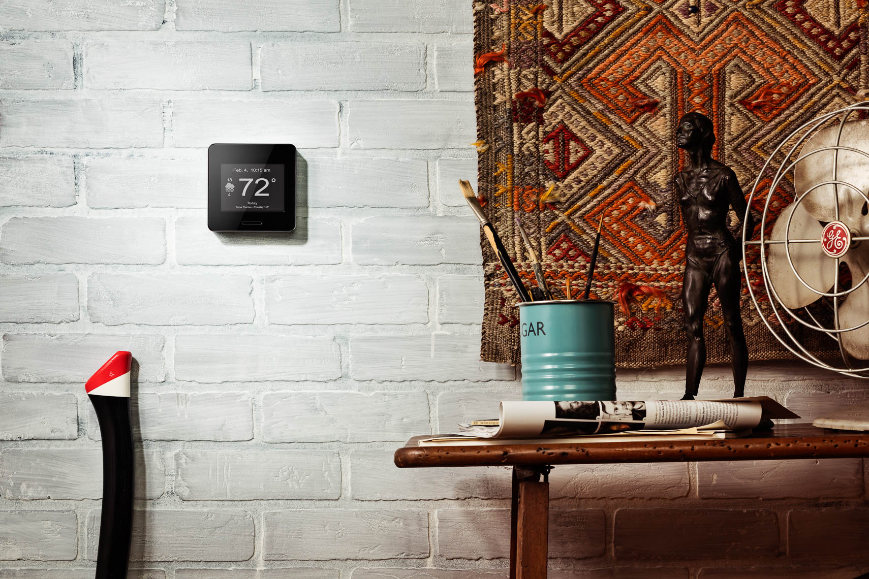 product photography photographer lifestyle photography of wifi weather station on white brick wall