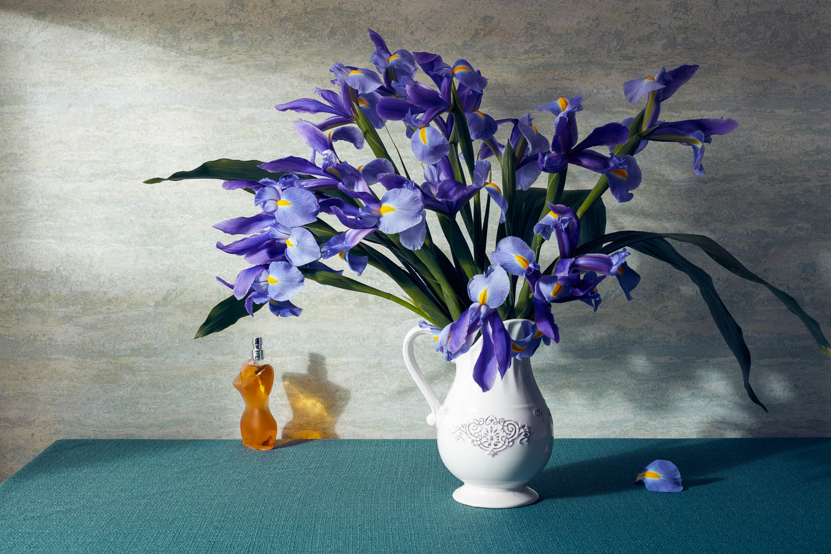 product photographer iris flowers and perfume still life photography with vase 